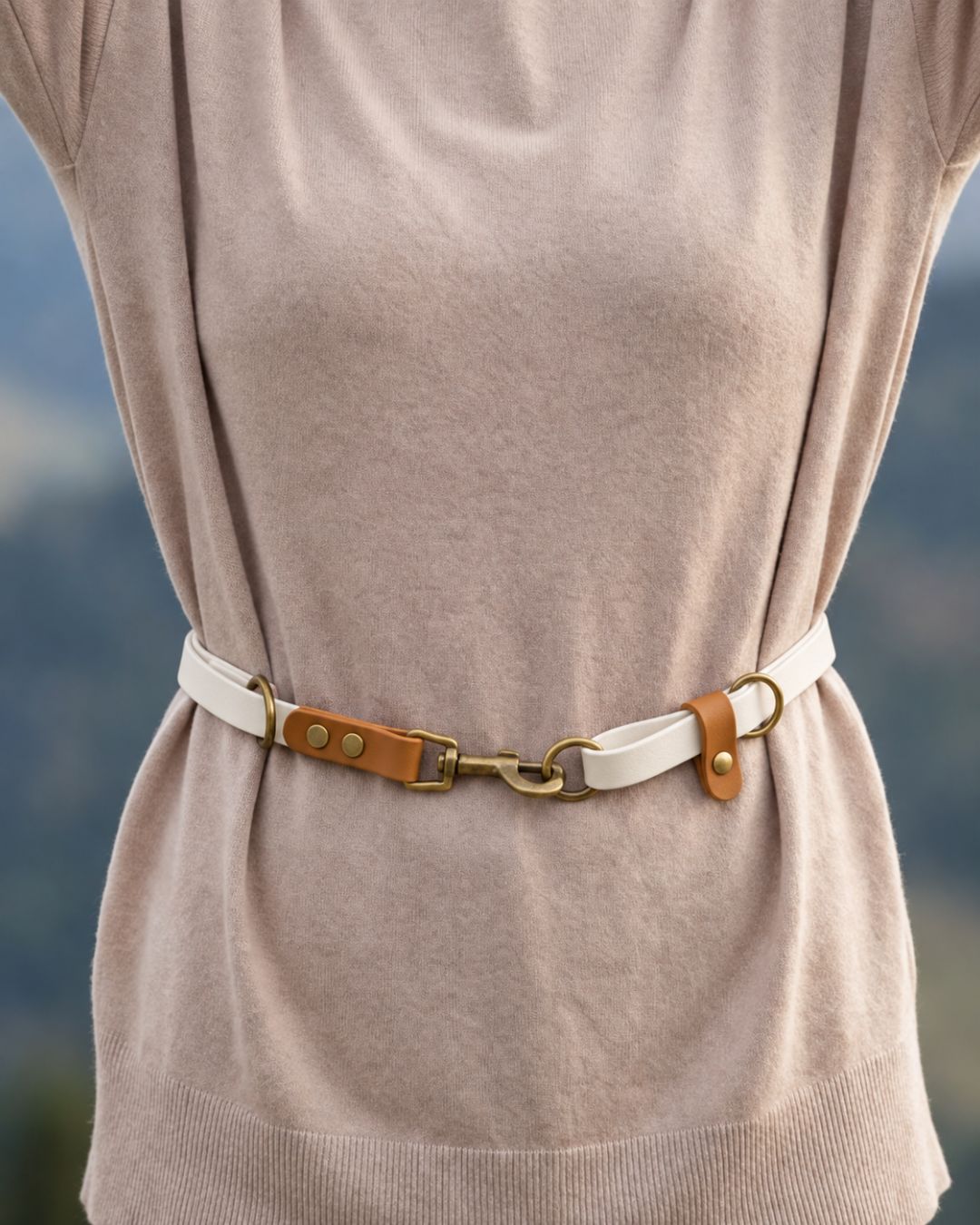 FREE worn around the waist, showing the antique brass snap hook, rings and BioThane® stoppers.